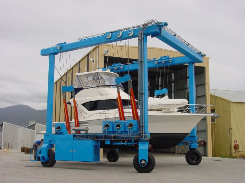 Cleanlift travel lift carrying a boat outside the yard shed